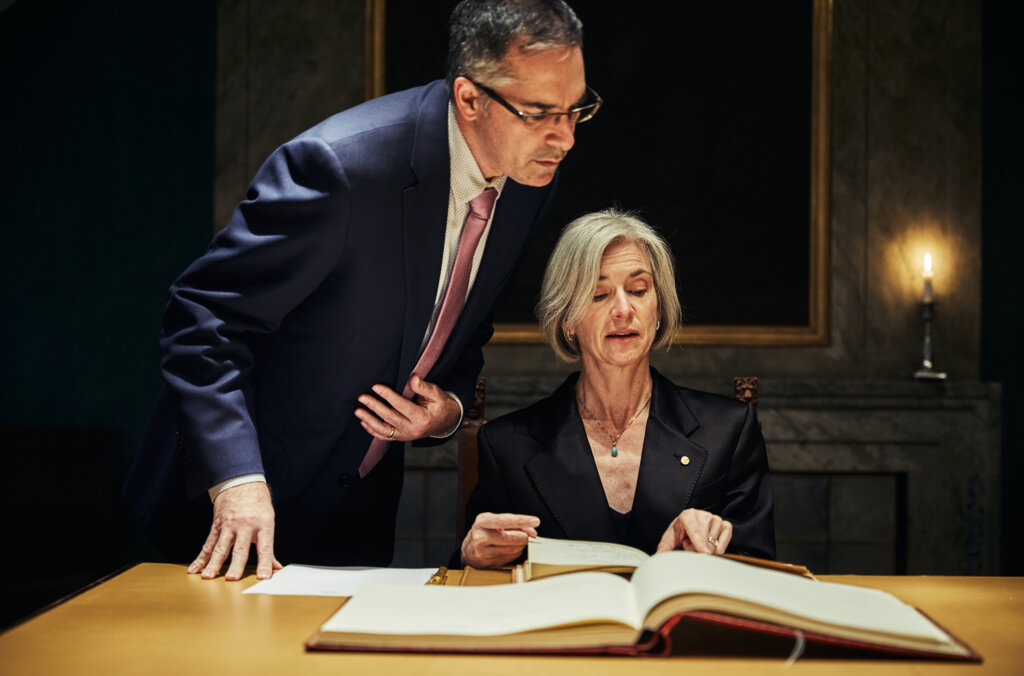 Jennifer Doudna points to a signature in the Nobel Foundation guest book.