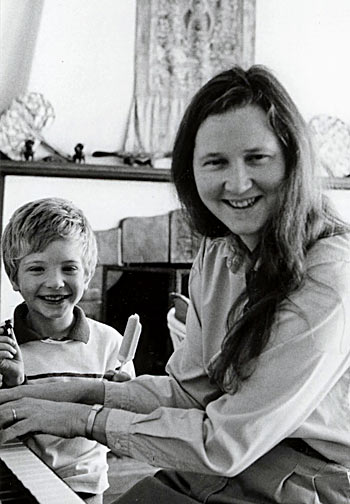 Elizabeth and her son, Ben, at the piano. Circa 1990
